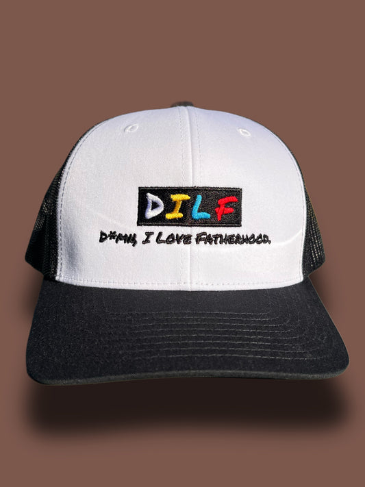 Classic DILF trucker hat with white front panel and embroidered D*mn I Love Fatherhood logo on a brown background